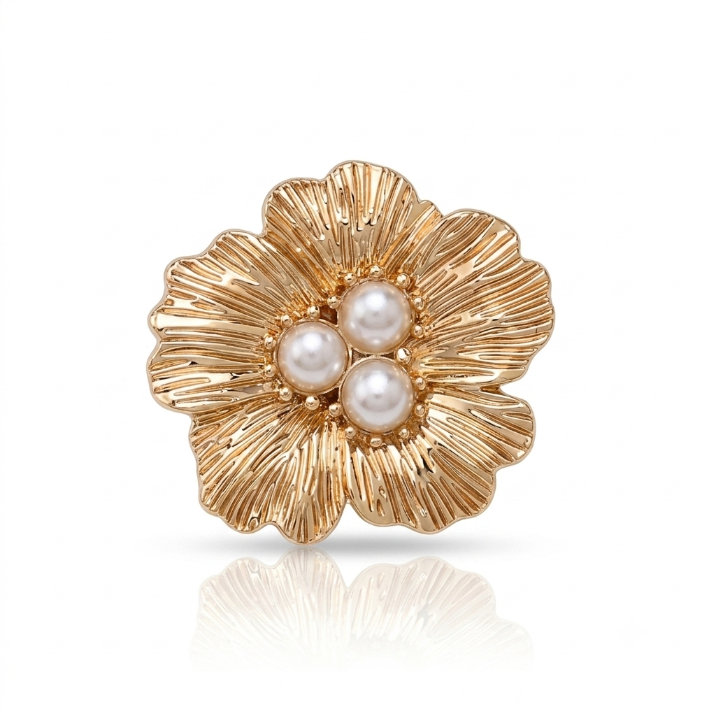 A gold flower-shaped stud earring with three white faux pearls at the center, shown on a clean white background with a soft reflection below.